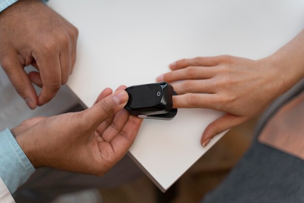 top view patient with pulse oximeter 23